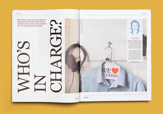 Open newspaper with the headline 'who's in charge?' on a mustard background